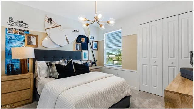 a bedroom with bed and window