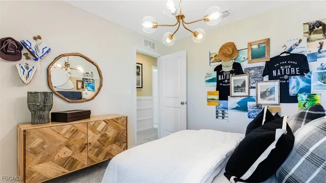 a bedroom with furniture and a window