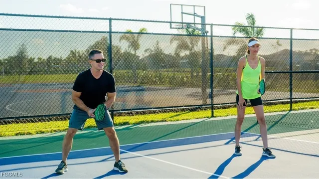 a view of swimming pool with a patio and a swimming pool