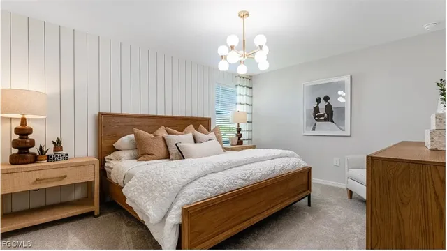 a bedroom with bed and window