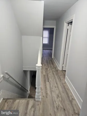 a view of entryway with wooden floor