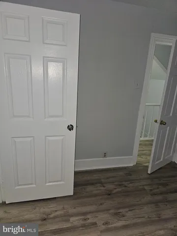 a view of room with hardwood floor