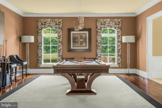 a living room with a bed and a window