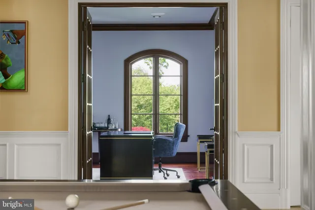 a dining room with furniture and a fireplace