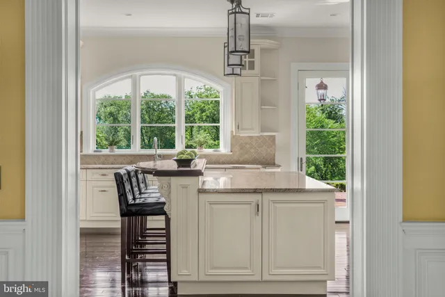 a kitchen with stainless steel appliances granite countertop a stove and cabinets