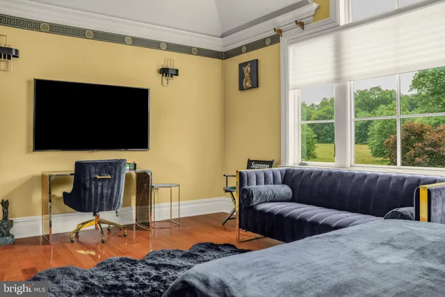 a bedroom with a bed and a couch