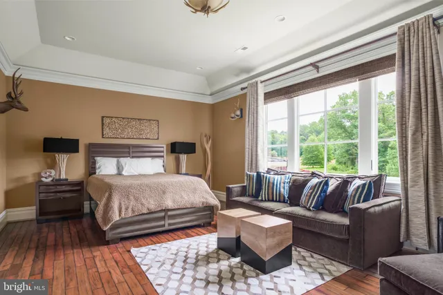 a bedroom with a bed and a car