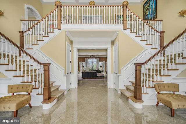 a view of staircase with wooden floor and a rug