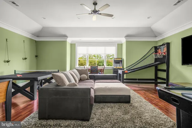 a front view of a house with a garden and trees