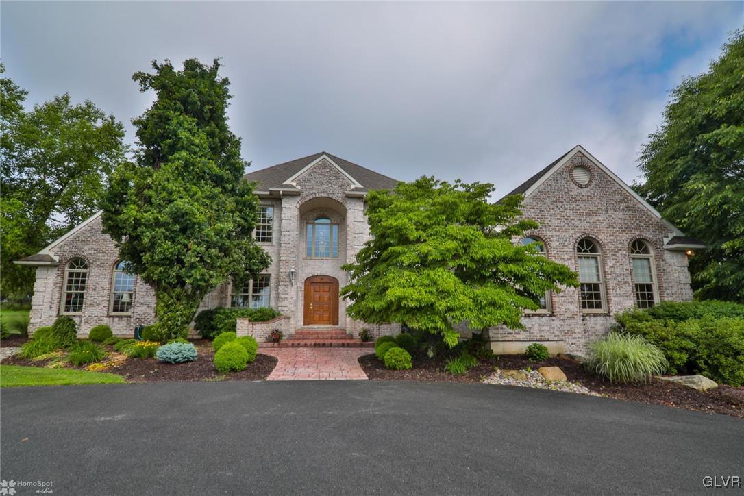 618 Bok Road Nazareth, PA 18064 - Photo 1 of 50 a front view of a house with a garden and plants