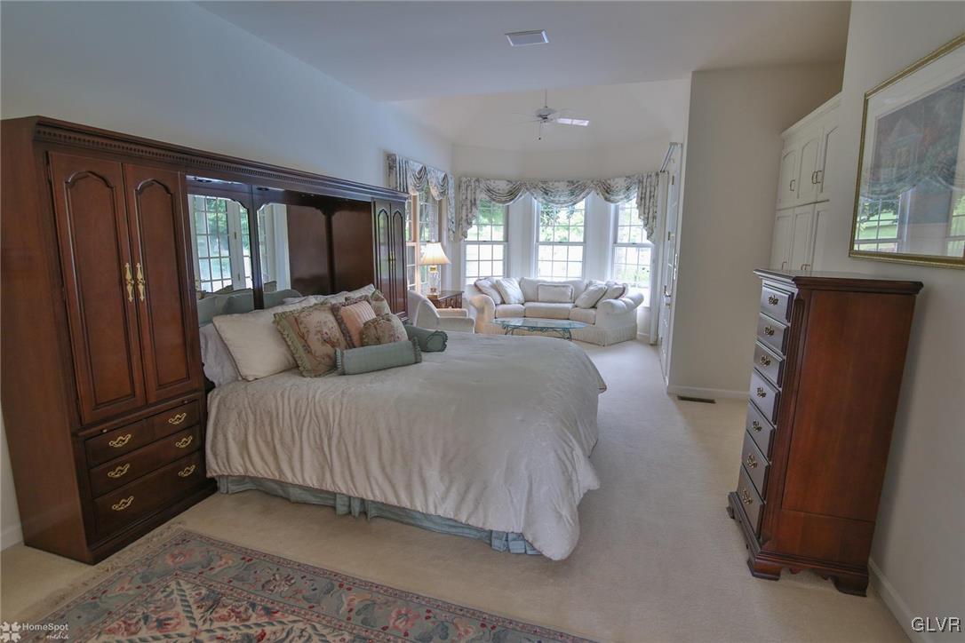 618 Bok Road Nazareth, PA 18064 - Photo 17 of 50 a spacious bedroom with a bed and a dresser next to a window