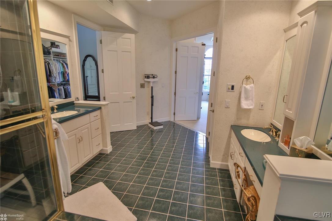 618 Bok Road Nazareth, PA 18064 - Photo 21 of 50 a bathroom with a double vanity sink a toilet and a mirror