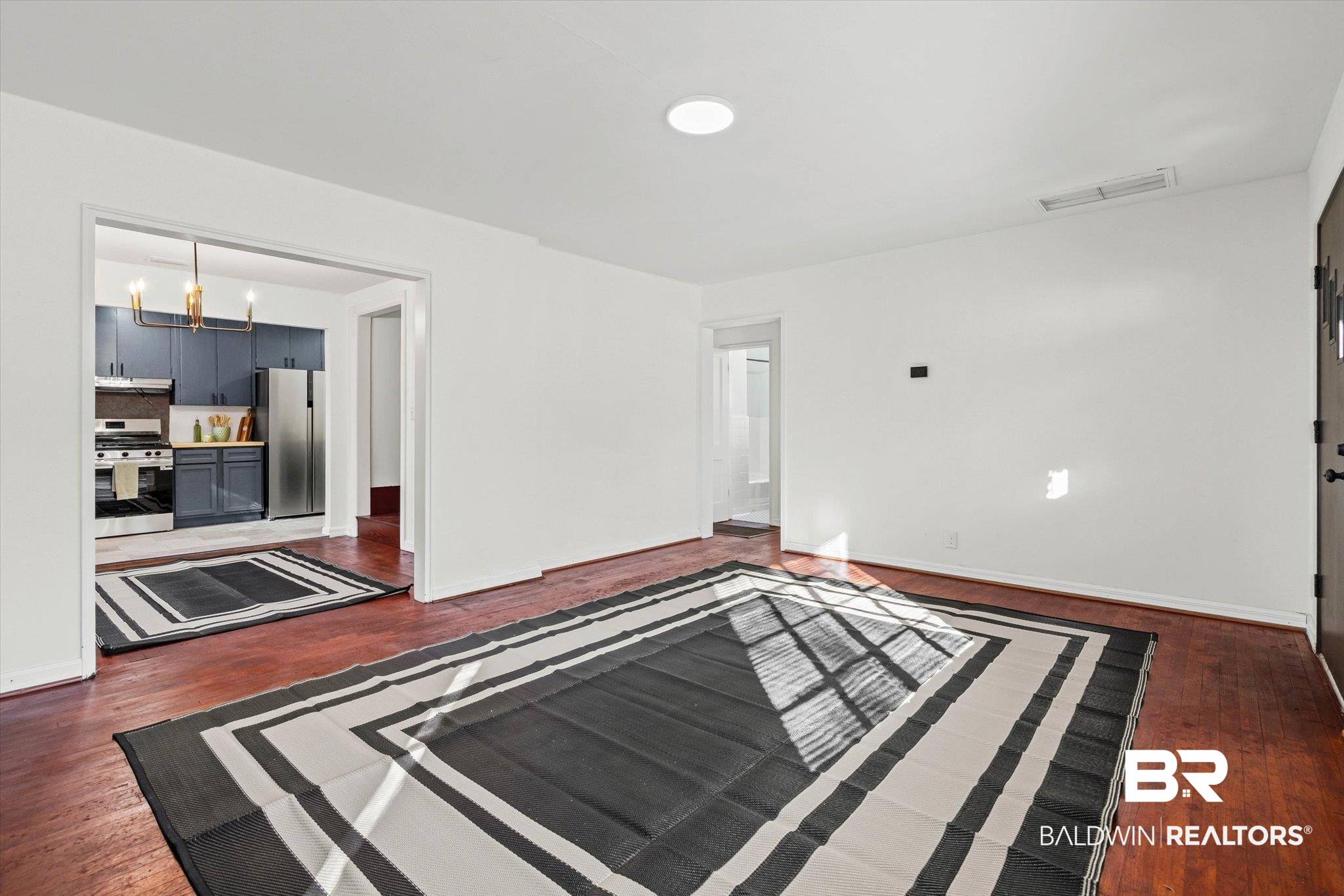 2806 Exter Drive Mobile, AL 36606 - Photo 4 of 24 Unfurnished room featuring dark wood finished floors and baseboards