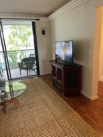 a room with furniture and wooden floor