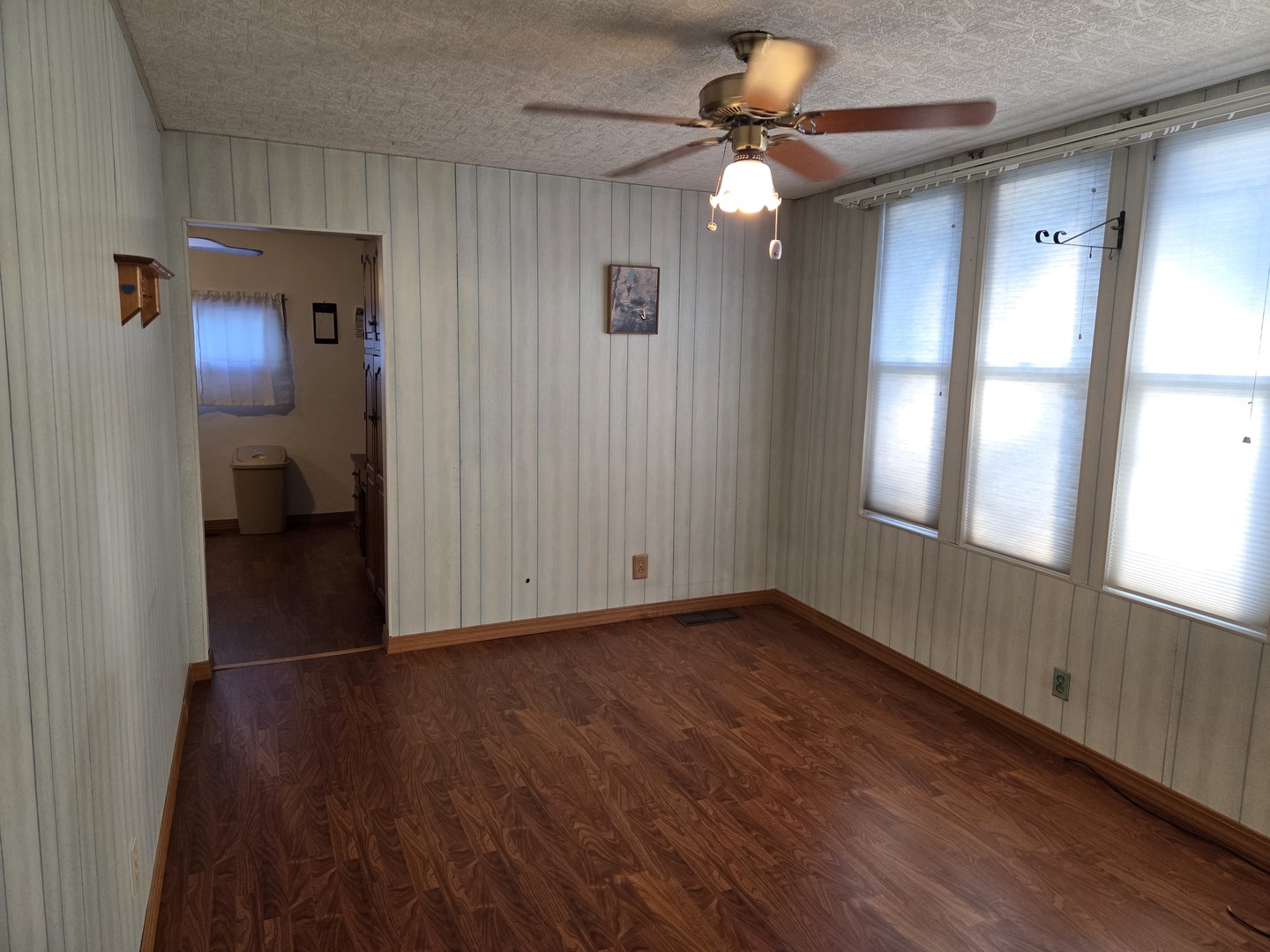 712 East Monroe Street Bloomington, IL 61701 - Photo 12 of 34 a view of an empty room with window and wooden floor