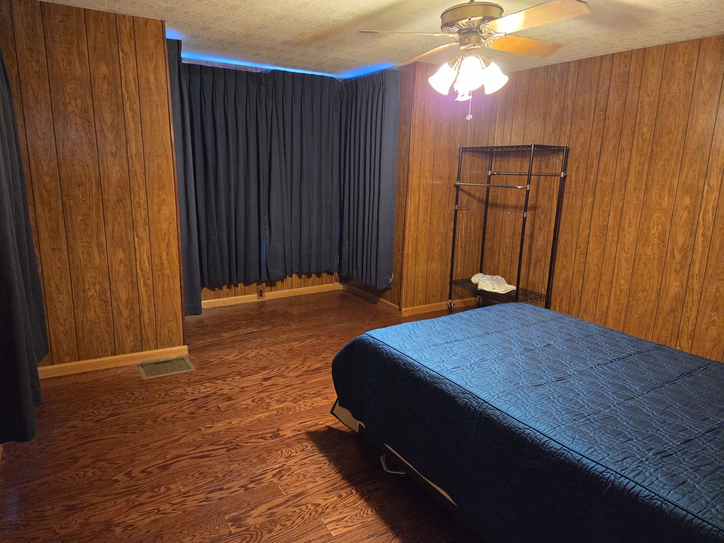 712 East Monroe Street Bloomington, IL 61701 - Photo 16 of 34 a bedroom with a bed and a chandelier