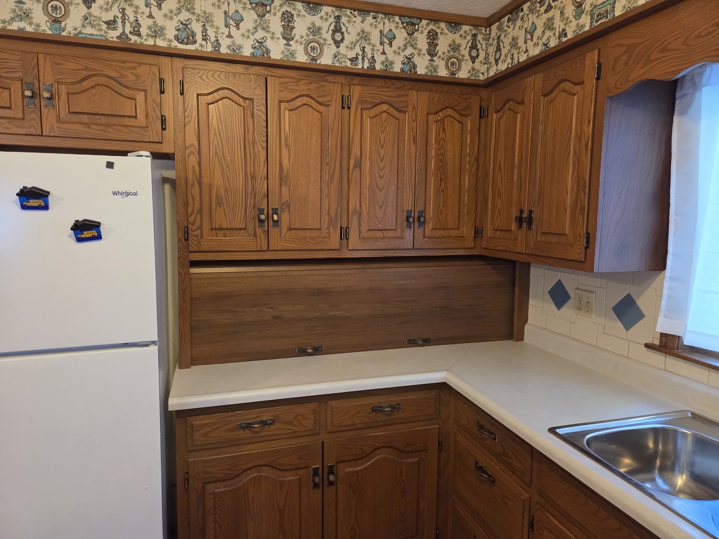 712 East Monroe Street Bloomington, IL 61701 - Photo 5 of 34 a kitchen with granite countertop a sink a stove and a refrigerator