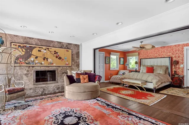a living room with furniture fireplace and window