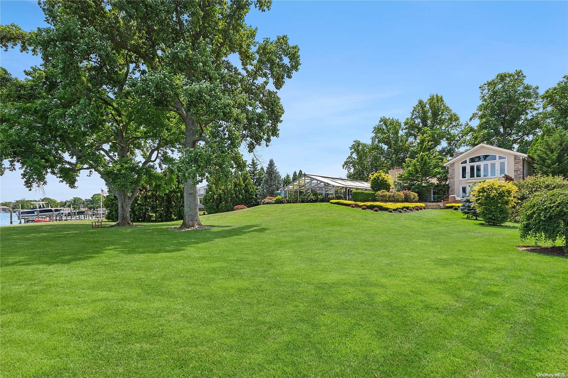 293 Great River Road Great River, NY 11739 - Photo 27 of 30 a front view of a house with garden