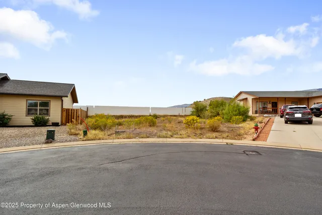 a view of a car parked in front of a building