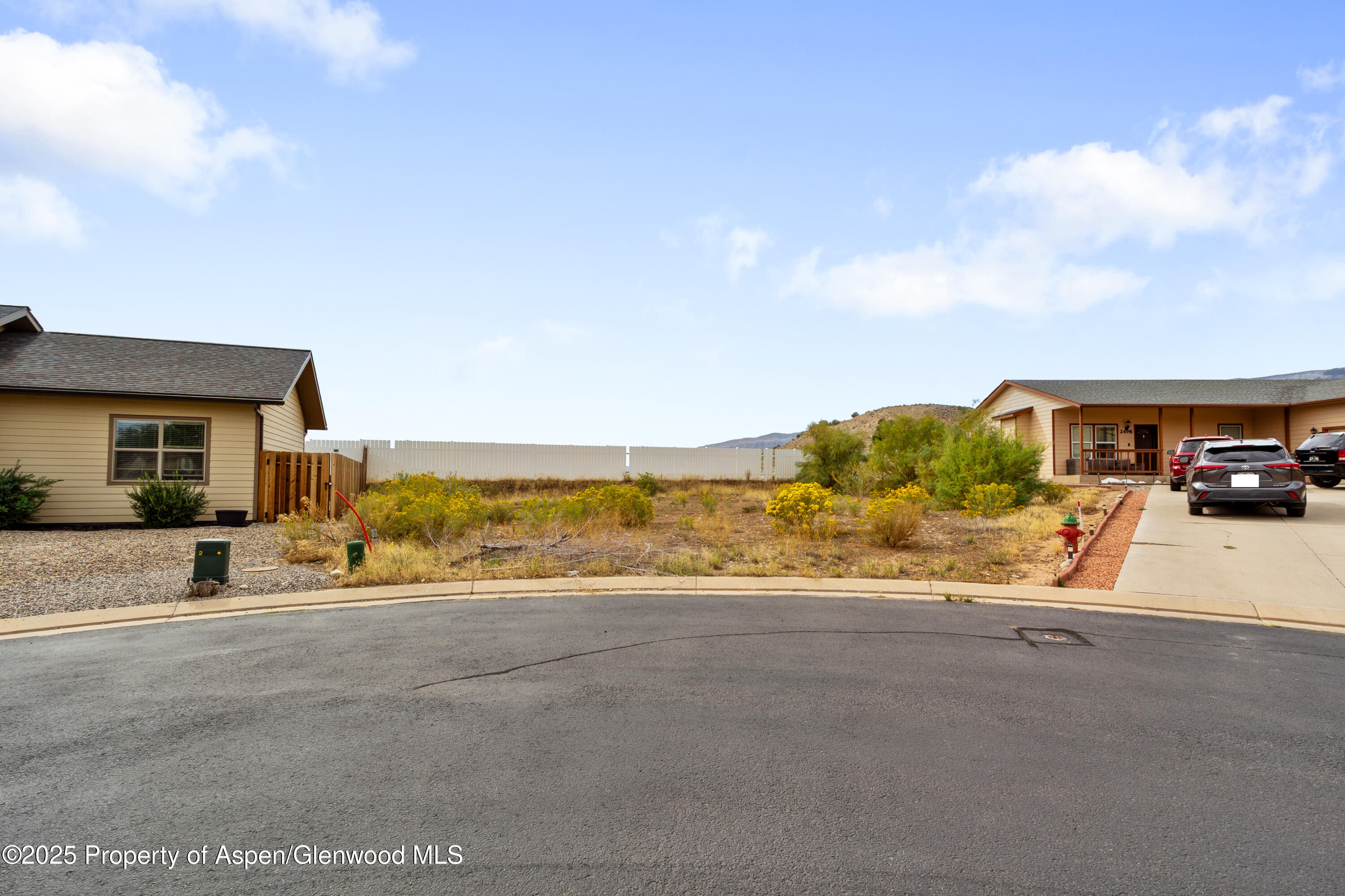 a view of a car parked in front of a building