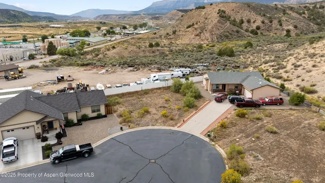 an aerial view of a house with a ocean view