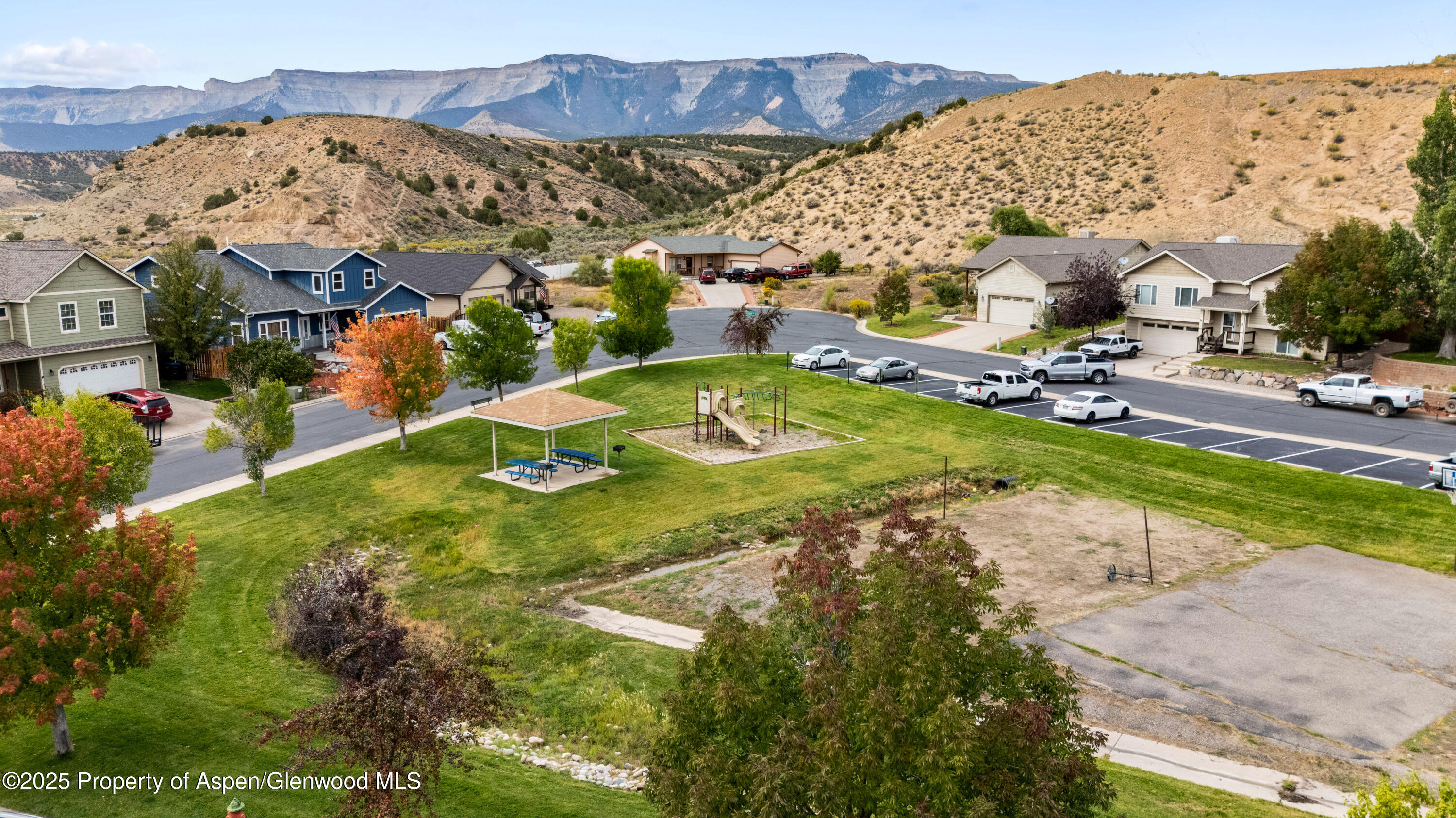 2495 Pioneer Way Rifle, CO 81650 - Photo 5 of 8 an aerial view of residential houses with outdoor space and trees