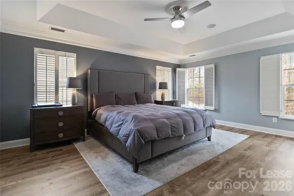 a spacious bedroom with a large bed and a window