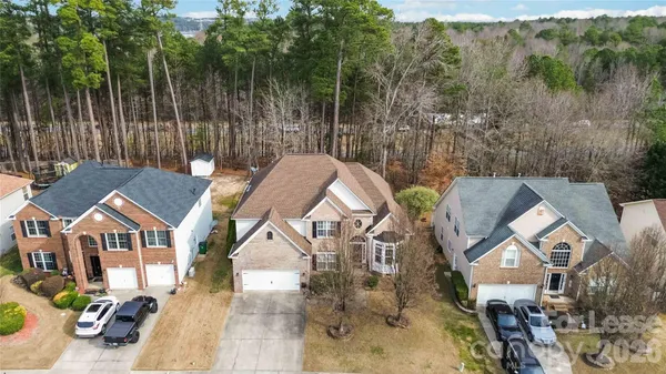 an aerial view of a house with outdoor space