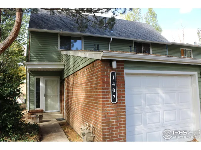 a view of a house with a garage and windows