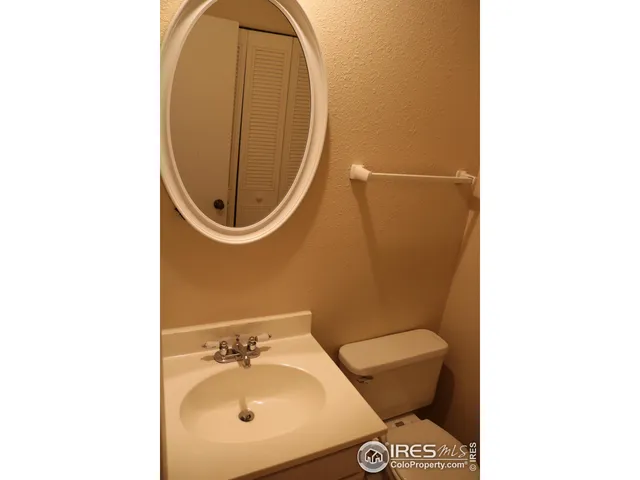 a bathroom with a toilet and a sink