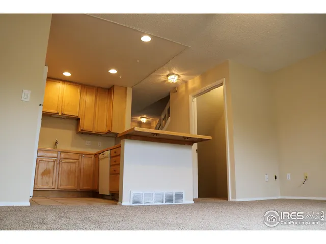 a view of kitchen with cabinets and wooden floor