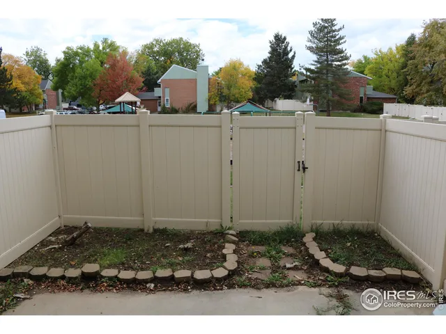 a view of an empty room with a fireplace
