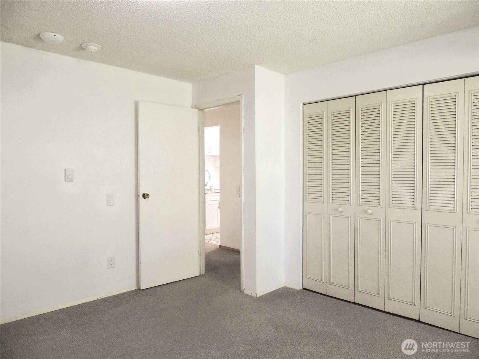 19409 56th Avenue West, Unit 306 Lynnwood, WA 98036 - Photo 11 of 21 a view of an empty room with closet area