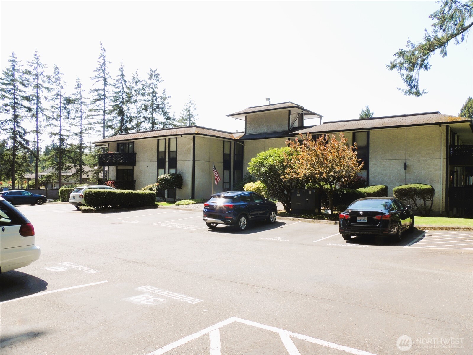 19409 56th Avenue West, Unit 306 Lynnwood, WA 98036 - Photo 18 of 21 a view of a car parked in front of a building