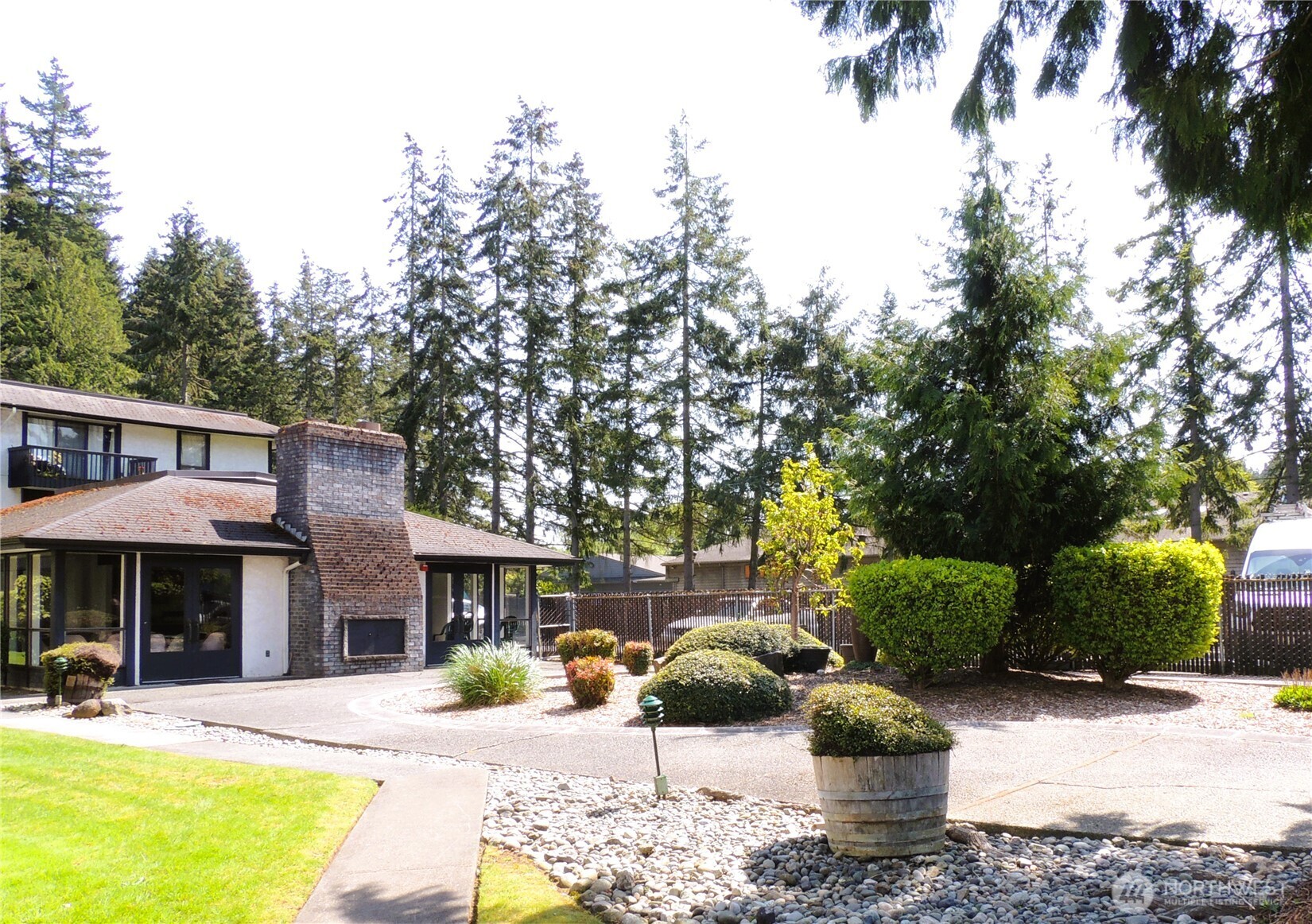 19409 56th Avenue West, Unit 306 Lynnwood, WA 98036 - Photo 20 of 21 a view of a house with swimming pool and sitting area
