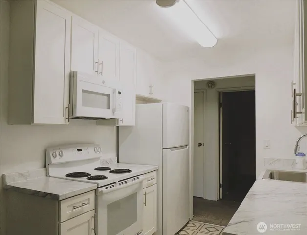 a bathroom with a sink toilet and vanity