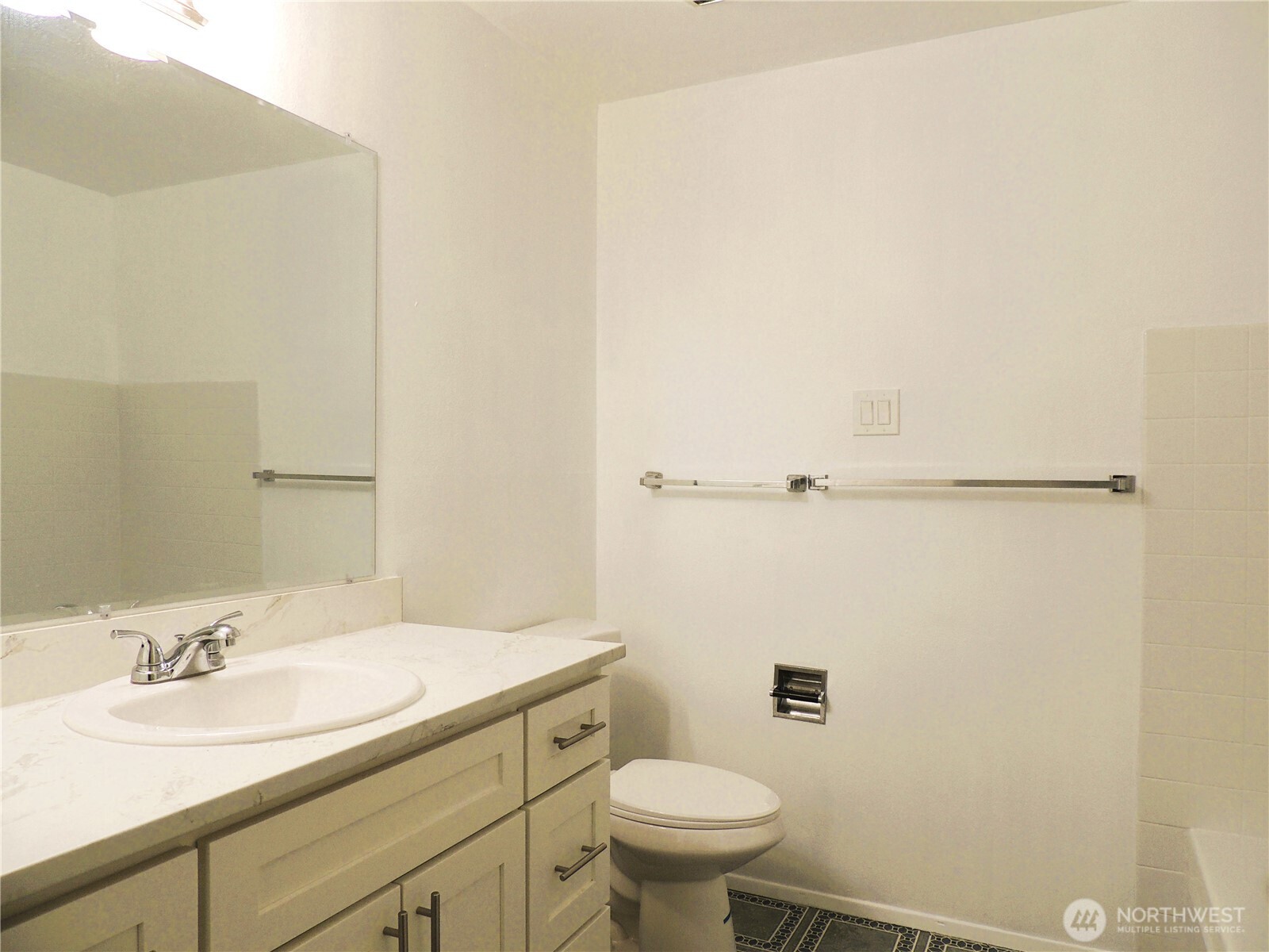 19409 56th Avenue West, Unit 306 Lynnwood, WA 98036 - Photo 9 of 21 a bathroom with a sink toilet and vanity