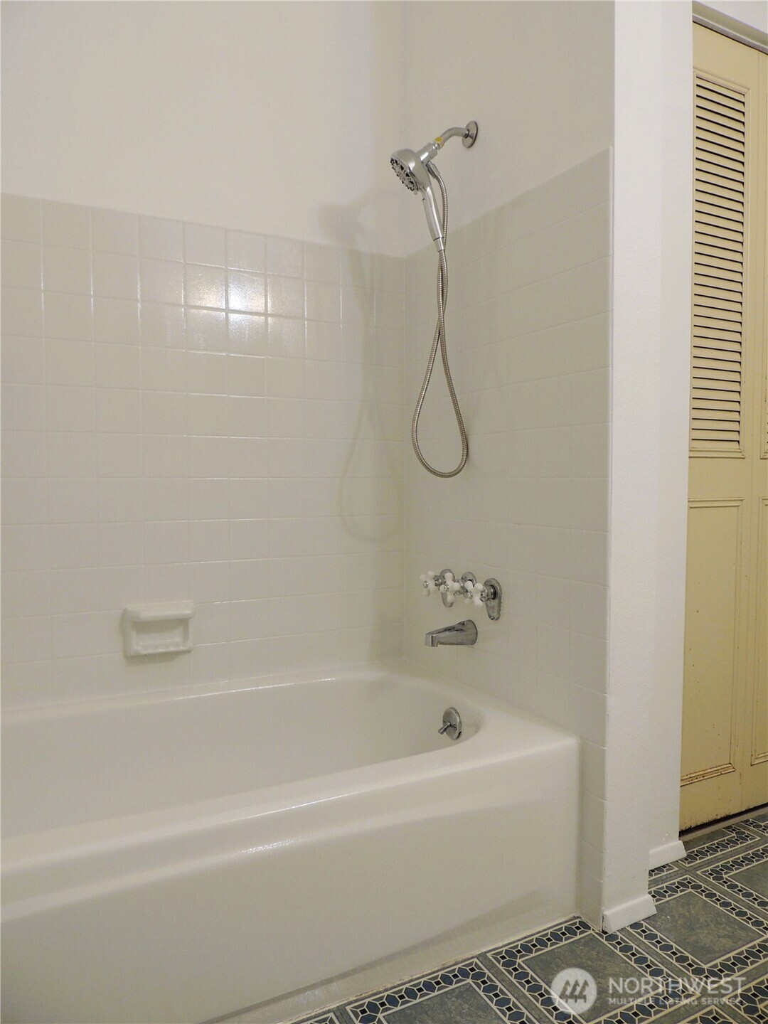 19409 56th Avenue West, Unit 306 Lynnwood, WA 98036 - Photo 10 of 21 a bathroom with a bath tub and a shower