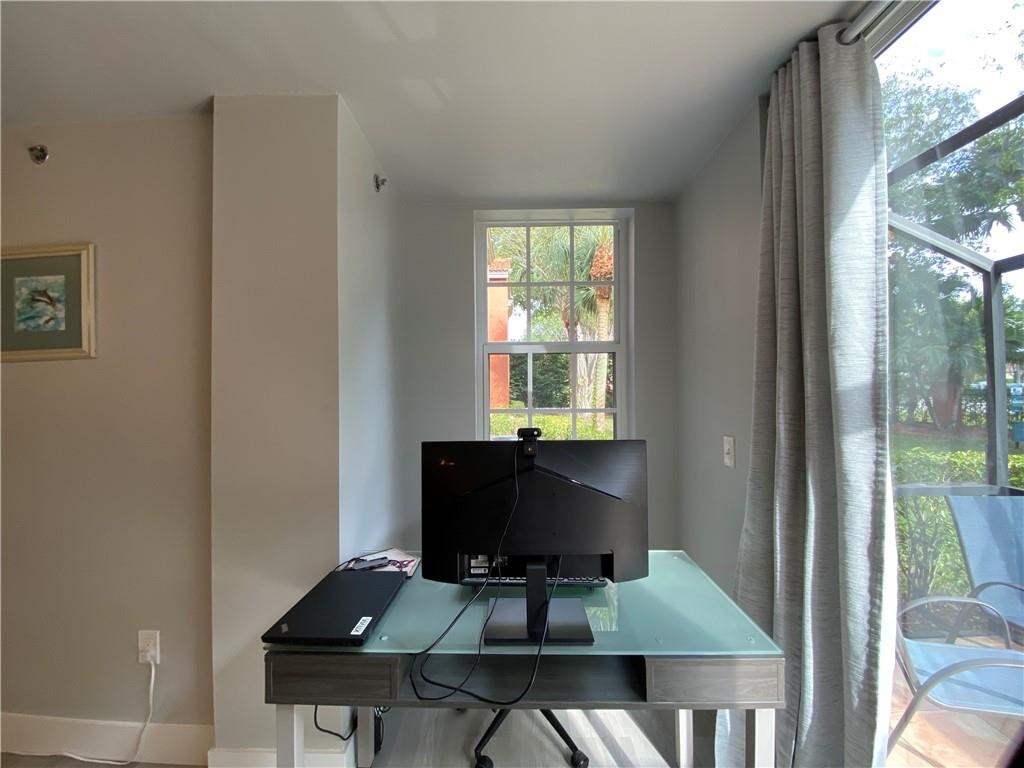 3207 Clint Moore Road, Unit 104 Boca Raton, FL 33496 - Photo 12 of 46 a view of workspace with a window