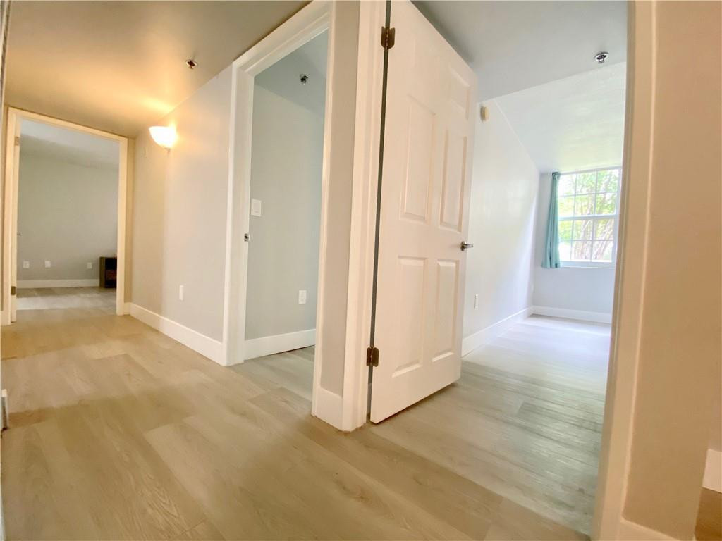 3207 Clint Moore Road, Unit 104 Boca Raton, FL 33496 - Photo 17 of 46 a view of a room with an empty space and windows