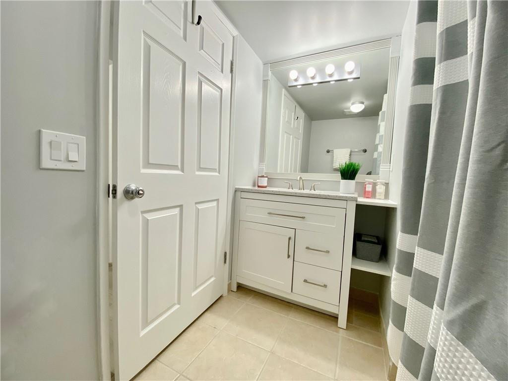 3207 Clint Moore Road, Unit 104 Boca Raton, FL 33496 - Photo 19 of 46 a view of a hallway with washer and dryer