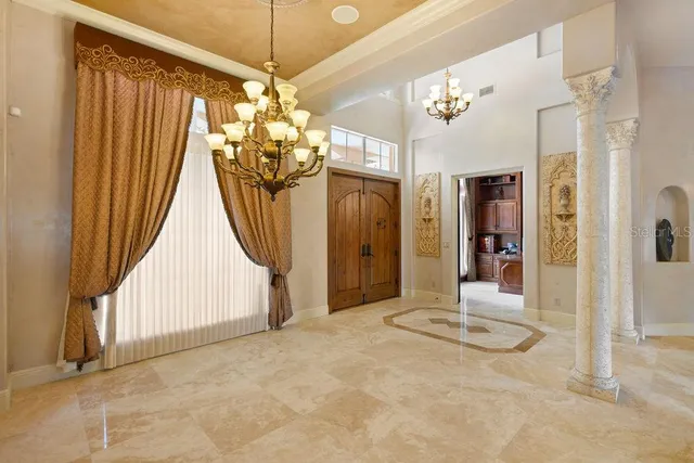 a kitchen that has a lot of cabinets in it