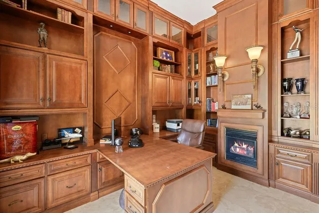 a large kitchen with a table and chairs