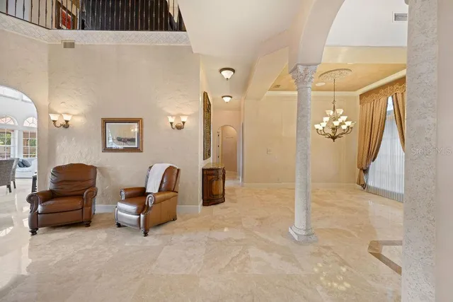 a kitchen with stainless steel appliances granite countertop a sink a stove and a wooden floors