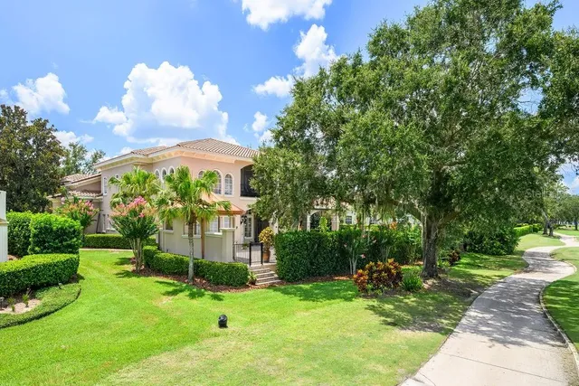 a view of a lake with houses in front of it