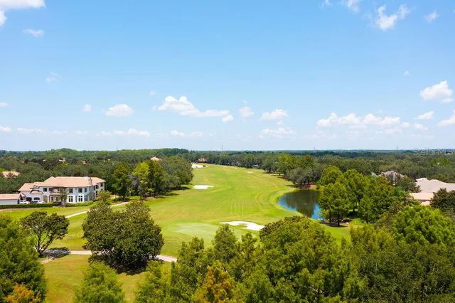 an aerial view of house with yard swimming pool and outdoor seating