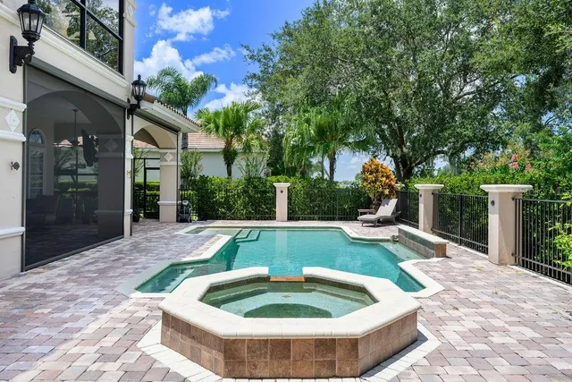 a view of a backyard with plants and a patio