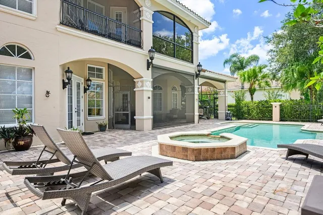 a view of a house with backyard porch and patio