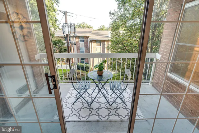 a view of balcony with furniture
